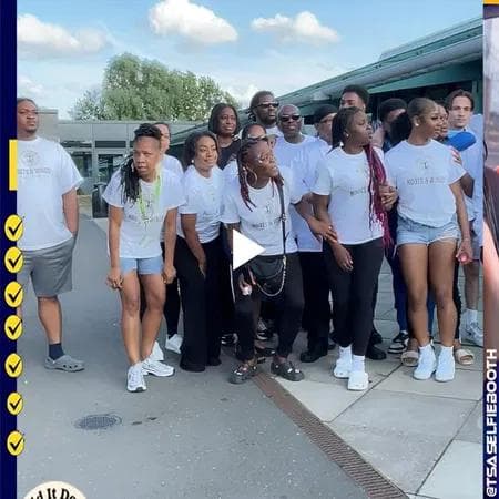 Volunteers and families at the Roots & Wings Family Fun Day