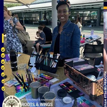 Face painting station at Roots & Wings event